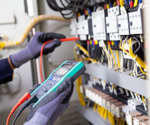 Electrical Technical Worker Testing Circuit Using Multimeter Odenton Md