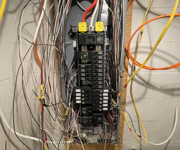 Electrical Panel With Multiple Wires And Breakers In Basement Odenton Md